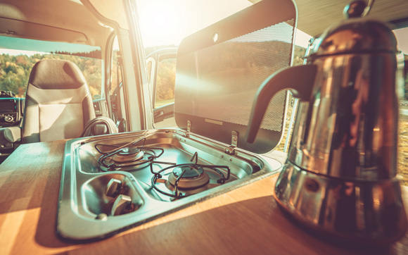 A small gas stove inside an RV