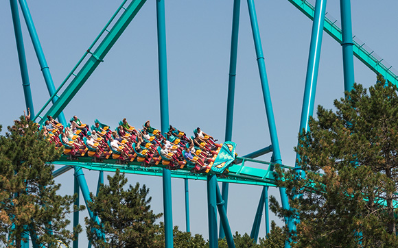 A long view of a large working rollercoaster full of people